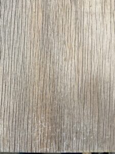 weathered cladding resulting from uncoated and untreated plywood