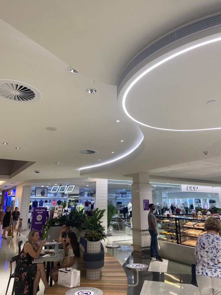 Curved plasterboard ceiling using MDF as a template for a shopping centre makeover